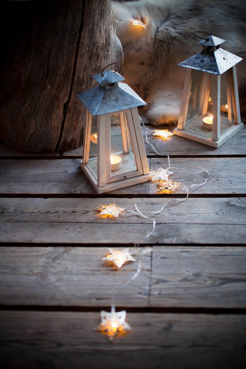 Porch decorated with lanterns and Christmas lights