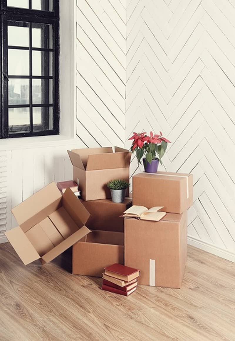 Moving home. Cardboard boxes on the floor